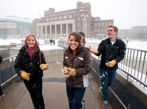 Students outside on the mall while it's snowing