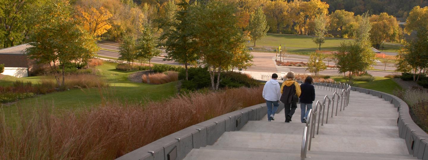 Students take the steps behind Coffman Student Union down toward the Mississippi River